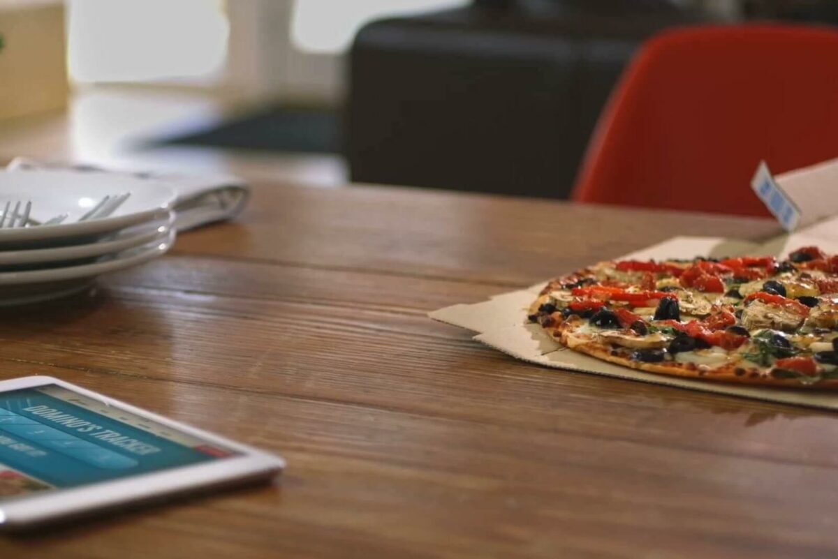 Domino's thin-crust pizza and tablet open to Domino's Tracker