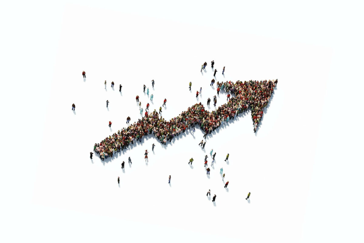 A group of people forming an arrow to symbolize progress